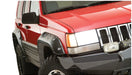 Red jeep grand cherokee with cutout style fender flares - black