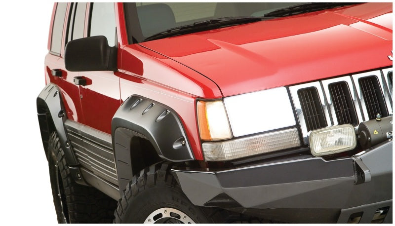 Red jeep grand cherokee with cutout style fender flares - black