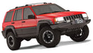 Red jeep grand cherokee with black cutout style fender flares and wheels