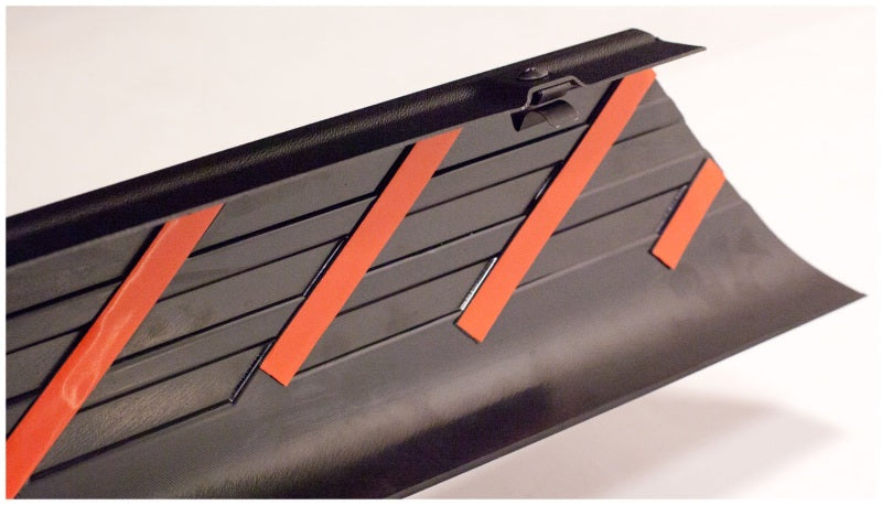 Side panel of a car with red stripes - bushwacker 95-04 toyota tacoma fleetside bed rail caps