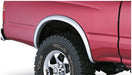 Red truck with white rim and black wheels with bushwacker toyota tacoma fleetside fender flares