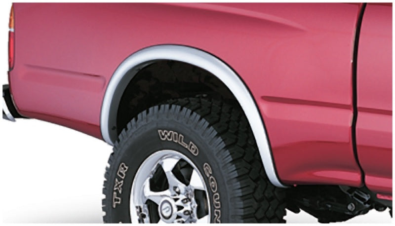 Red truck with white rim and black wheels with bushwacker toyota tacoma fleetside fender flares