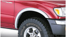 Red toyota tacoma fleetside fender flares with white lettering on truck