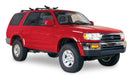 Red toyota 4runner truck with black roof rack - bushwacker fender flares