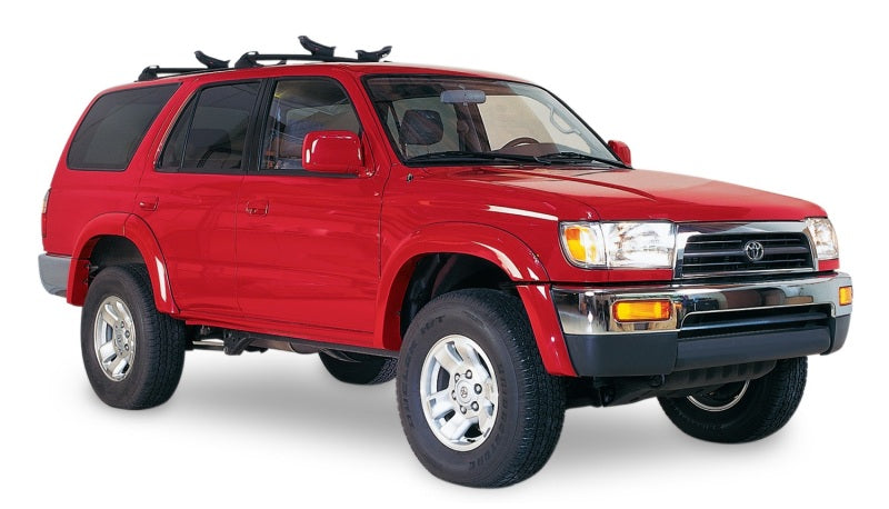 Red toyota 4runner truck with black roof rack - bushwacker fender flares