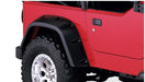 Red jeep with black tire cover - bushwacker pocket style fender flares for jeep tj max