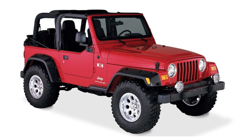 Red jeep tj with pocket style fender flares - black