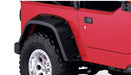 Red jeep with black tire cover - bushwacker 97-06 jeep tj pocket style fender flares