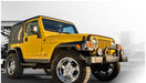 Yellow and black jeep tj with pocket style fender flares by bushwacker