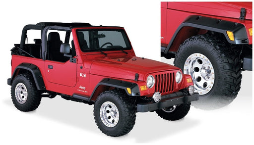 Red jeep with pocket style fender flares and white wheels - bushwacker 97-06 jeep tj 4pc in black