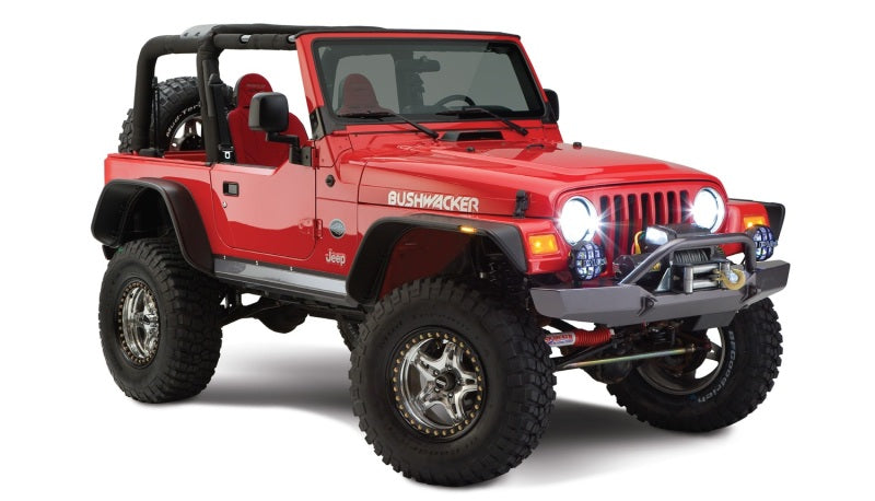 Red jeep wrangler with flat style fender flares by bushwacker - black