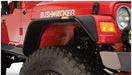 Red jeep with bushwacker flat style fender flares - black