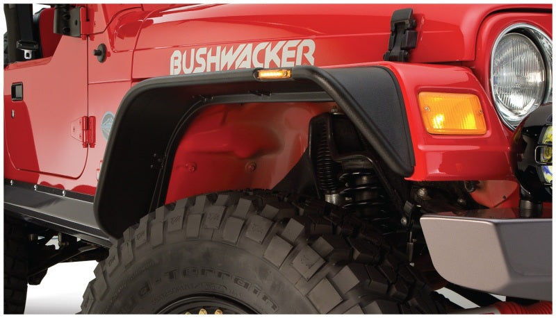 Red jeep with bushwacker flat style fender flares - black