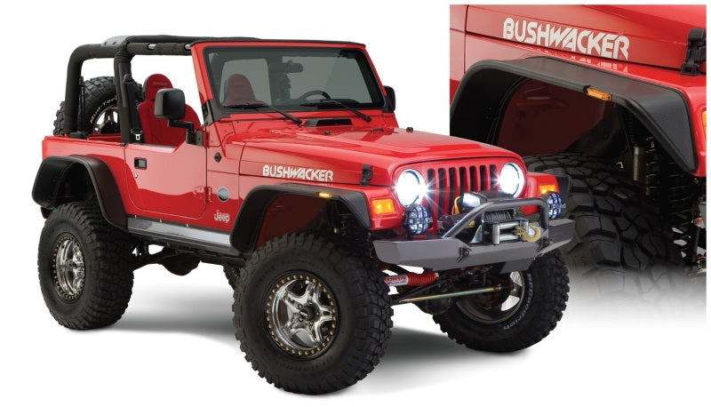 Red jeep with black bumper showcased against a white background - bushwacker flat style fender flares for 97-06 jeep wrangler