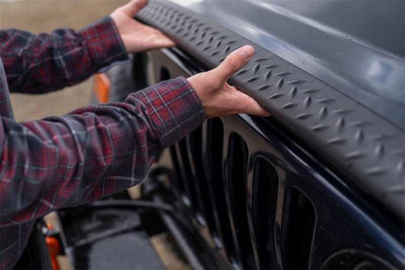 Man installing bushwacker jeep wrangler trail armor hood stone guard - black