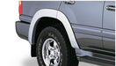 Toyota land cruiser silver suv with white tire cover - bushwacker oe style fender flares