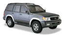 Toyota land cruiser suv with black roof rack - bushwacker fender flares