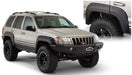 Bushwacker 99-04 jeep grand cherokee cutout style fender flares - black with large tire on jeep