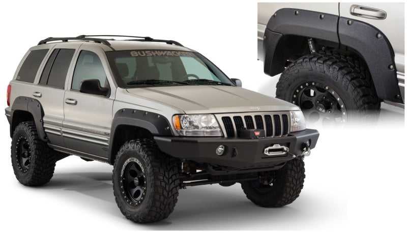 Bushwacker 99-04 jeep grand cherokee cutout style fender flares - black with large tire on jeep