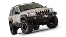 Black bushwacker fender flares for jeep grand cherokee with big tire on white background