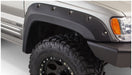 Close up of bushwacker fender flares on jeep grand cherokee, with tire and light