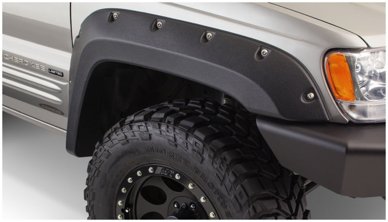 Close up of bushwacker fender flares on jeep grand cherokee, with tire and light