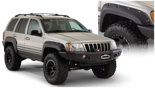 Close up of bushwacker fender flares on a jeep grand cherokee with large tire