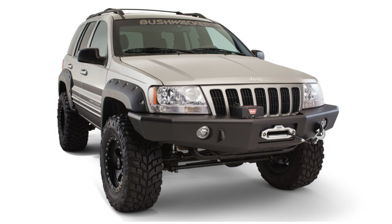 Bushwacker jeep grand cherokee fender flares with big tire on white background