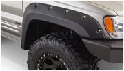 Bushwacker 99-04 jeep grand cherokee cutout style fender flares - close up truck tire and light