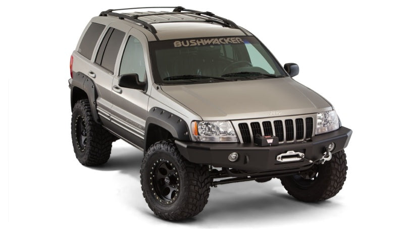 Bushwacker 99-04 jeep grand cherokee cutout style fender flares - black suv with black bumper on white background