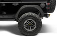 Black jeep with trail armor mud tire cover - bushwacker fender delete kit