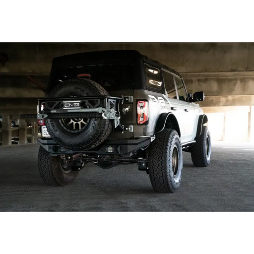 Black truck parked in parking garage with DV8 21-22 Ford Bronco 3rd Brake Light Extension Bracket.