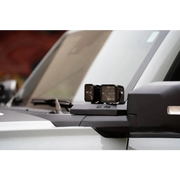 White car rear view mirror with DV8 Ford Bronco A-Pillar Pod Light Mounts.