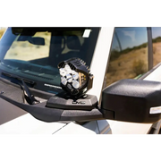 DV8 21-22 Ford Bronco A-Pillar Pod Light Mounts showcasing front view mirror of white car