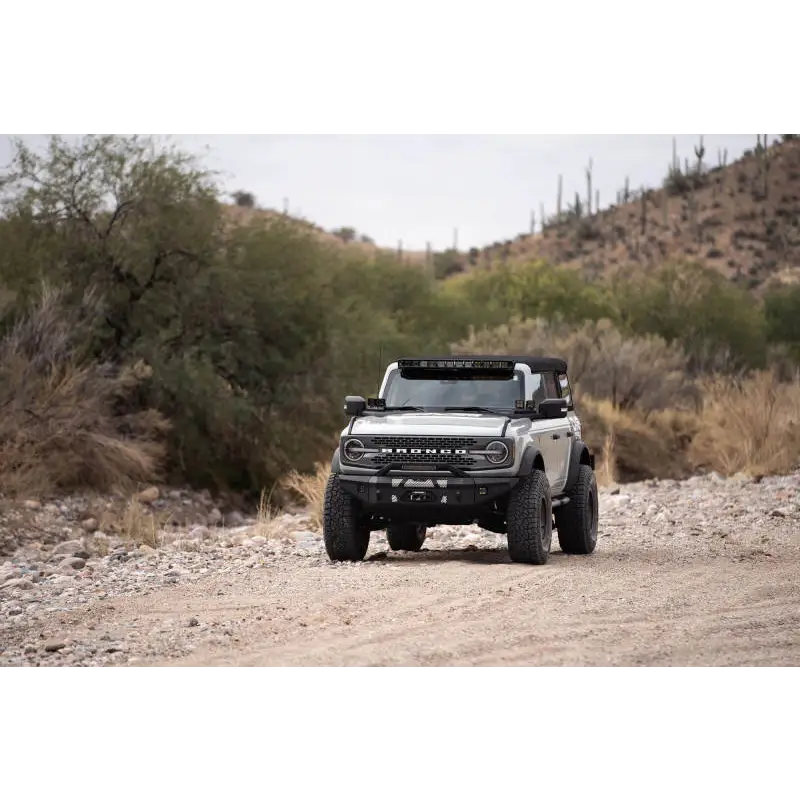 Ford Bronco A-Pillar Pod Light Mounts driving down dirt road.