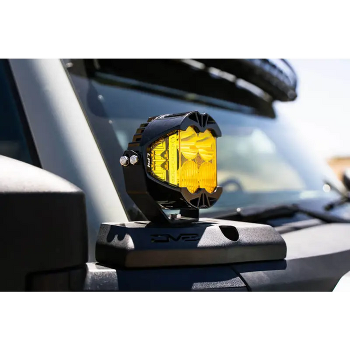 Yellow pod light mounted on Ford Bronco A-Pillar.