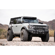 White truck parked on dirt road with DV8 A-Pillar Pod Light Mounts