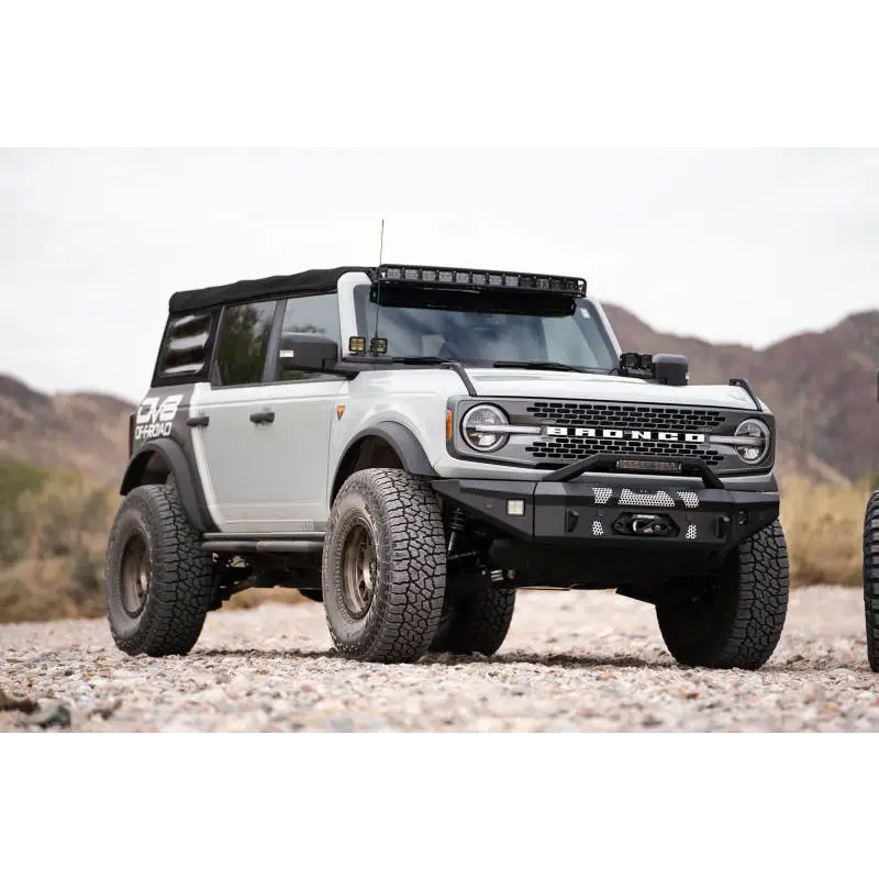 White truck parked on dirt road with DV8 A-Pillar Pod Light Mounts
