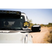 White truck with yellow and black emblem displaying DV8 Bronco A-Pillar Pod Light Mounts