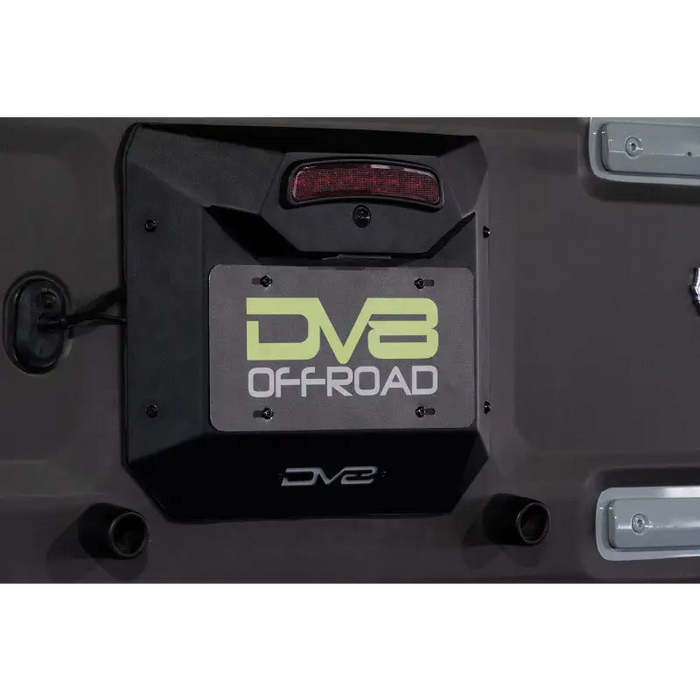 DV8 21-22 Spare Tire Delete with DVB logo on black and white boat