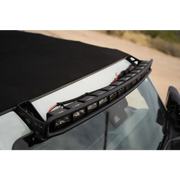 Close up of a Ford Bronco with roof light bar and DV8 21+ Curved Light Bracket