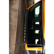 Ford Bronco curved light bracket with yellow bus in parking lot