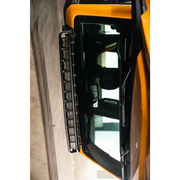 Yellow Ford Bronco front door with DV8 21+ Curved Light Bracket.