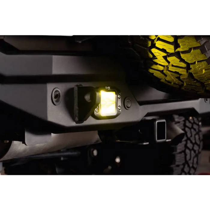 DV8 3-Inch Elite Series LED Amber Flush Mount Pod Light on black motorcycle bumper.