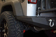 Close-up of dv8 offroad 07-18 jeep wrangler jk full-width rear bumper with tire