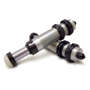 Pair of metal and black cylinders bump stops for Jeep Wrangler JK on white surface.