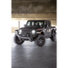 Black jeep parked in parking garage next to dv8 offroad mto series front bumper.