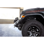 Black jeep wrangler jk with red logo on dv8 offroad mto series front bumper