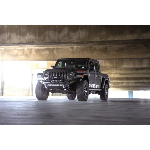 Black jeep parked in garage - dv8 offroad mto series front bumper for jeep wrangler, gladiator.