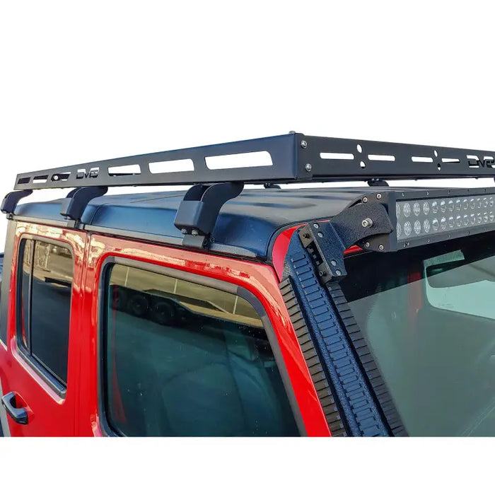 Black roof rack mounted on red Jeep - DV8 Offroad Gladiator Roof Rack
